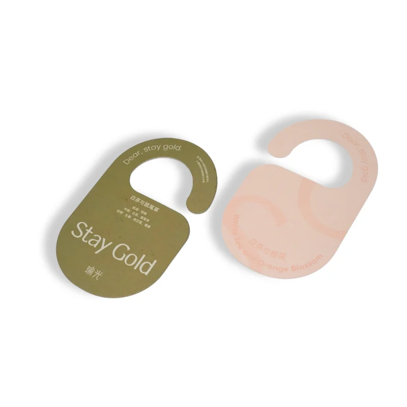 Peach-toned Stay Gold welcome fragrance card with orange blossom aroma